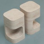 Twoe decorative elements like chair made of Iran Cream Travertine from Marbleopolis