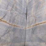 a close shot of bliss gold marble ( Levin Marble ) quarry before becoming big blocks