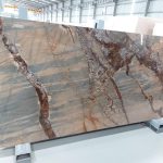Bliss Gold Marble ( Levin Marble ) Slab from Marbleopolis in a stone showroom